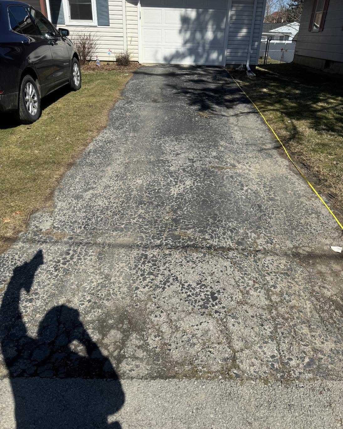 Worn and cracked garage approach before replacement