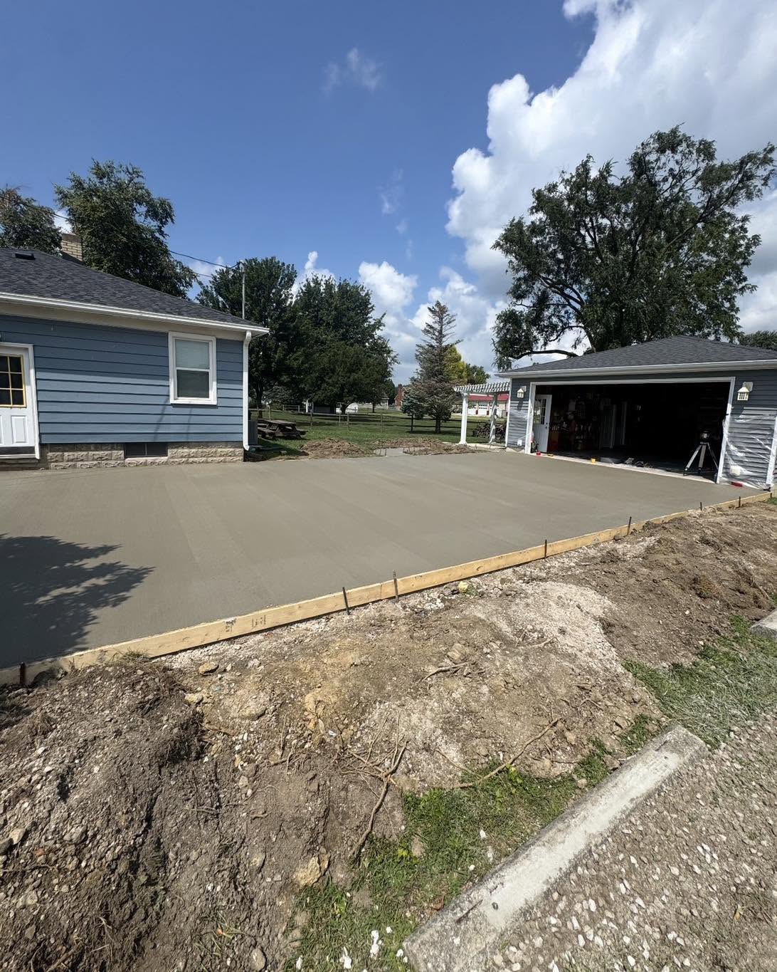Fresh concrete driveway and garage pad