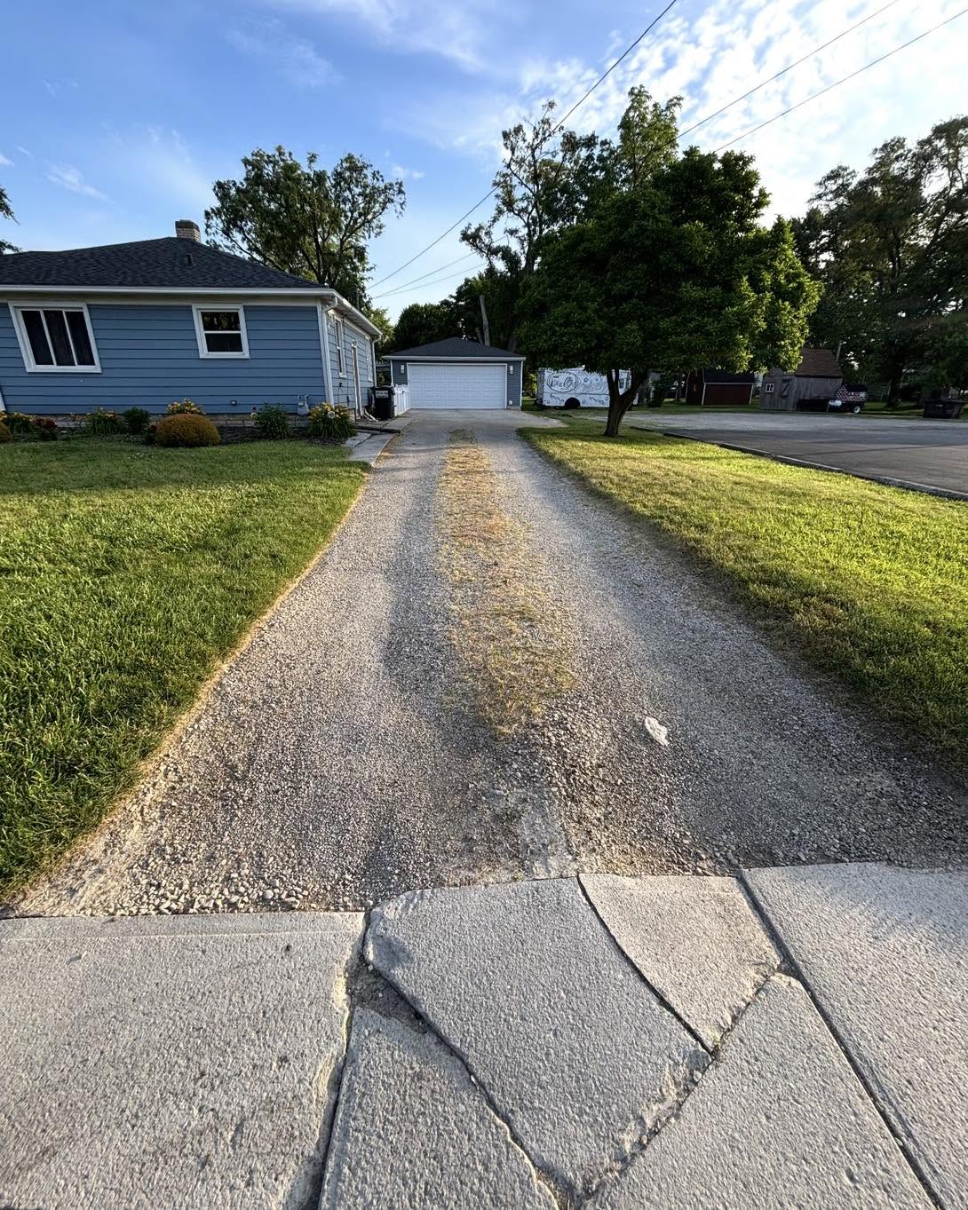 Gravel residential driveway before concrete replacement