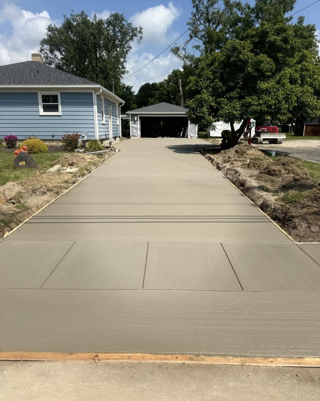 Freshly poured concrete driveway by Lake Erie Building Solutions