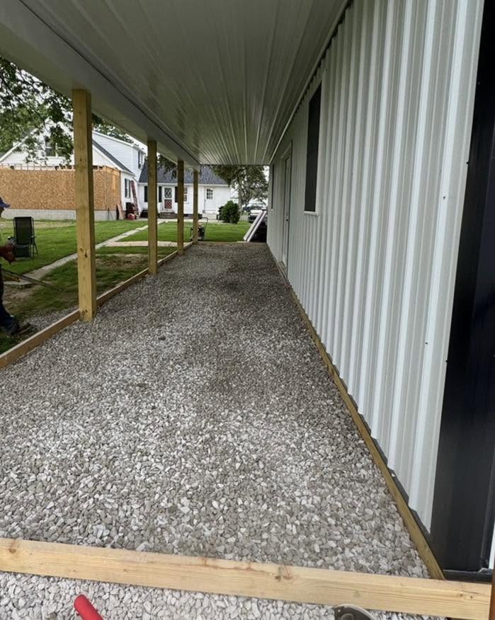 Prepared gravel base beneath a covered patio
