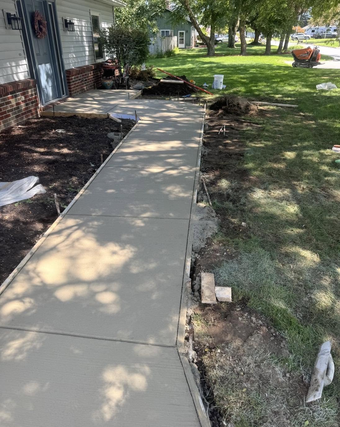 New front walkway being finished by the concrete crew